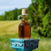Contrast the colors of your outdoor wedding with a golden bottle of maple syrup.