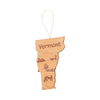 Wooden state of Vermont ornament with farm scene engraved.