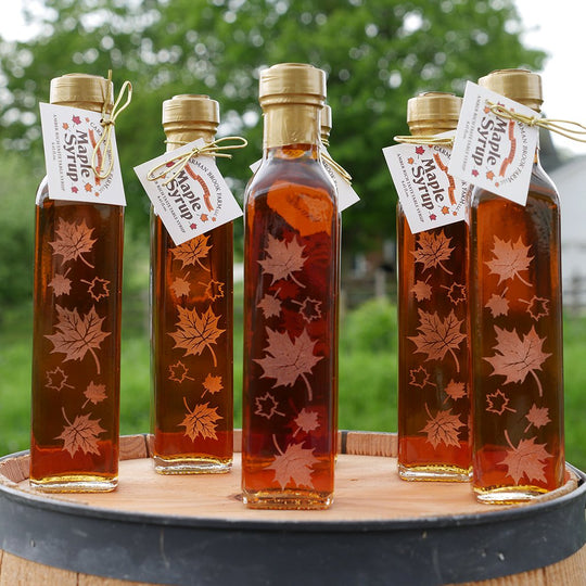 Group of engraved maple syrup client gifts 