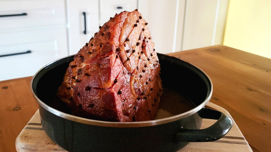 Maple glazed ham out of the oven and cooling.