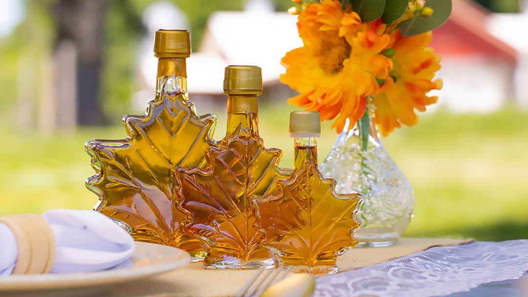 The three sizes of maple leaves for wedding favors at a farm place setting.