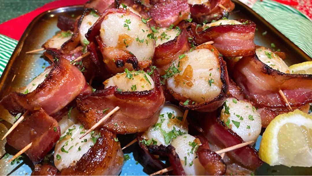 Plated for a holiday gathering, bacon wrapped scallops with a maple glaze.
