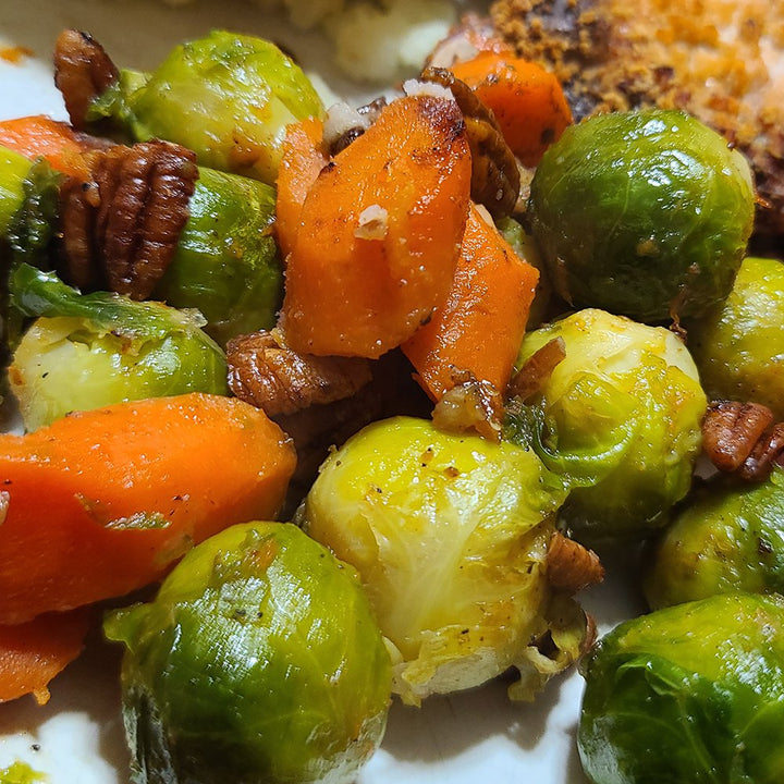 Brussel sprouts and carrots roasted on the stove top with pecans.