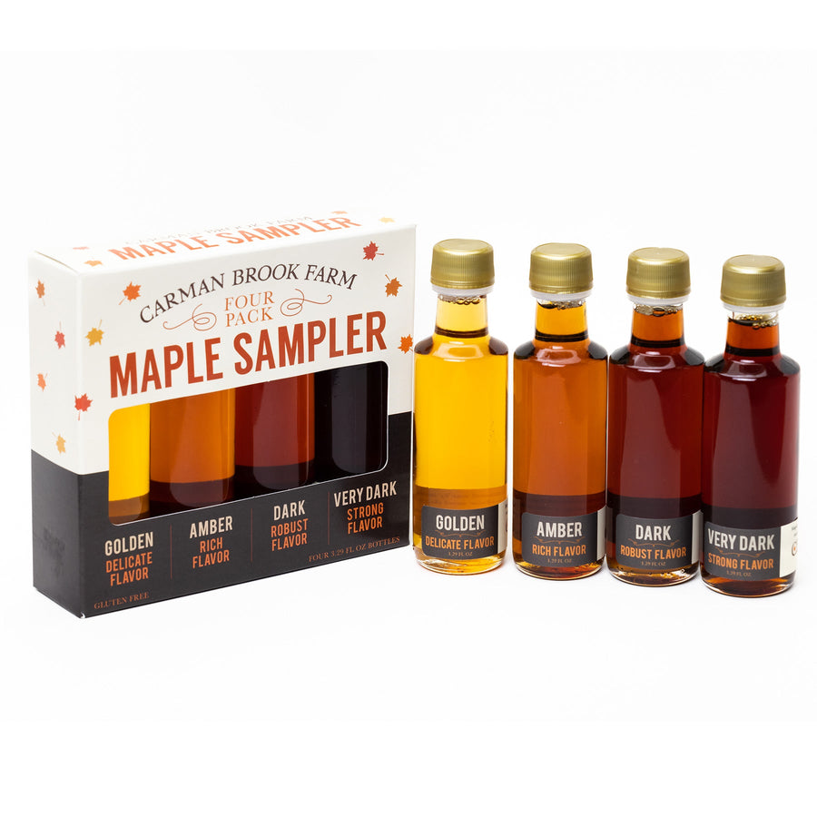 Vermont maple syrup sampler with four Grade A varieties displayed outside packaging.