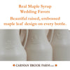 A raised, embossed maple leaf design is on every maple syrup favor bottle.
