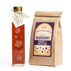 Autumn leaf bottle filled with amber rich taste maple syrup comes with your choice of blueberry pancake and waffle mix.