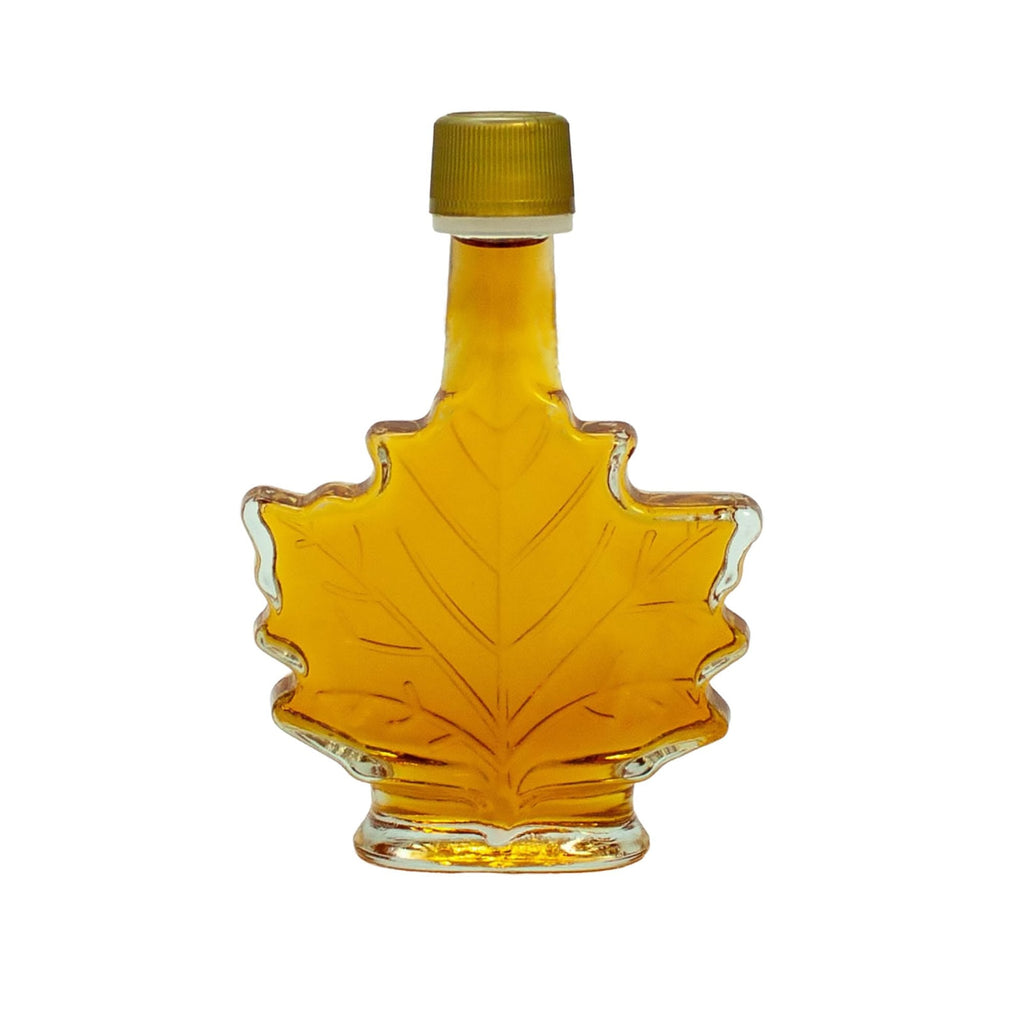 A maple leaf shaped bottle of maple syrup for a wedding favor.