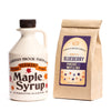 Quart of maple syrup with a choice of blueberry pancake and waffle mix.
