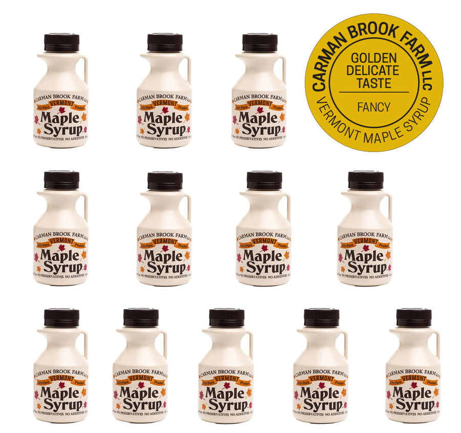 This image is a unit of 12 half pints of maple syrup with the emblem for the grade of Golden Delicate Taste/Fancy.