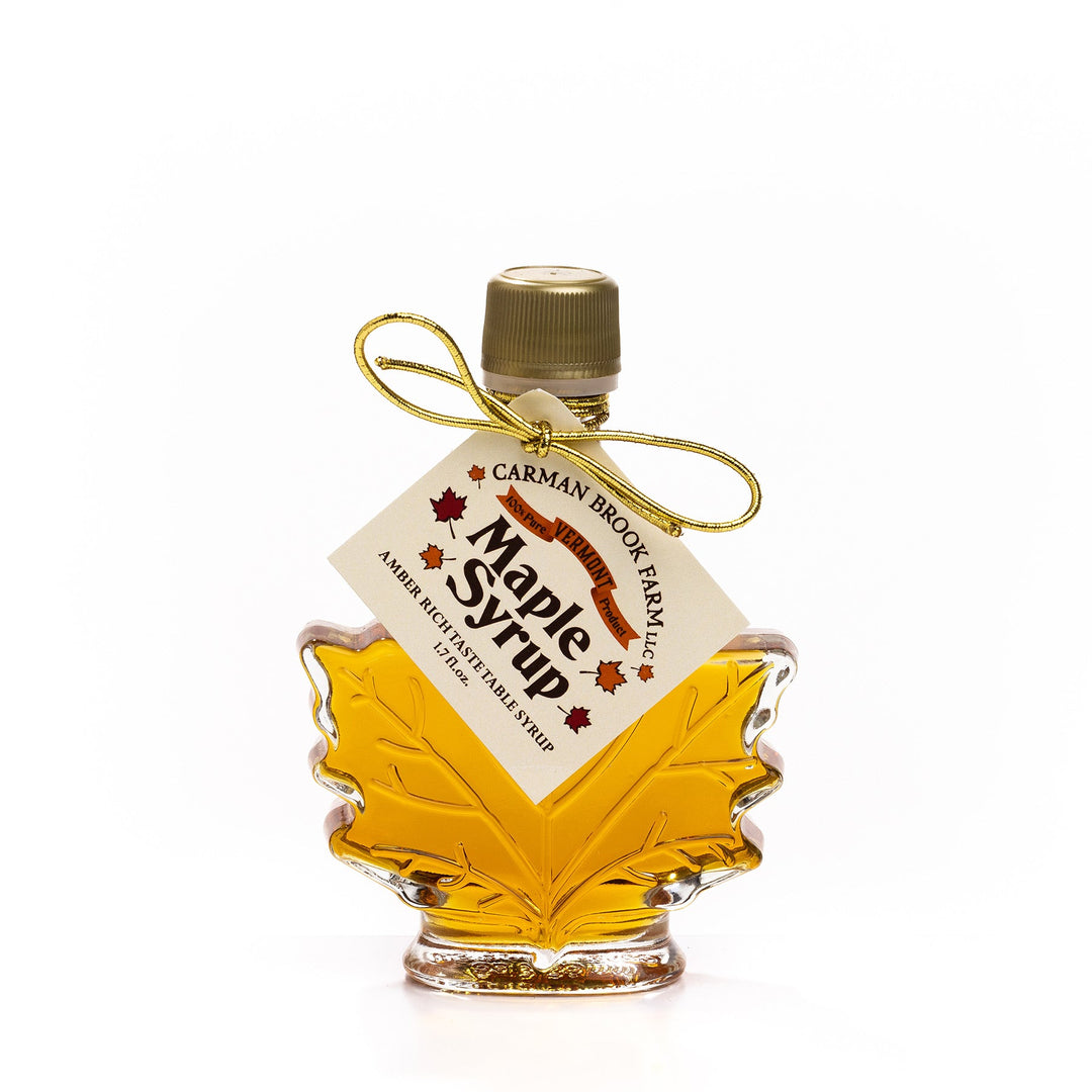 Small Vermont maple syrup leaf bottle in decorative glass.