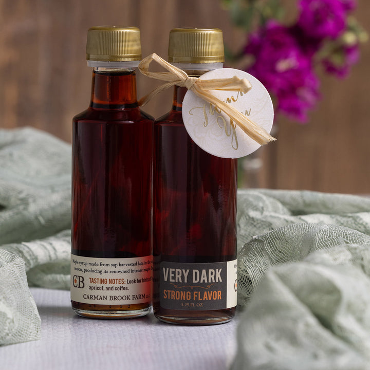Very dark strong Vermont maple syrup wedding favor bottle styled with deep rich tones.
