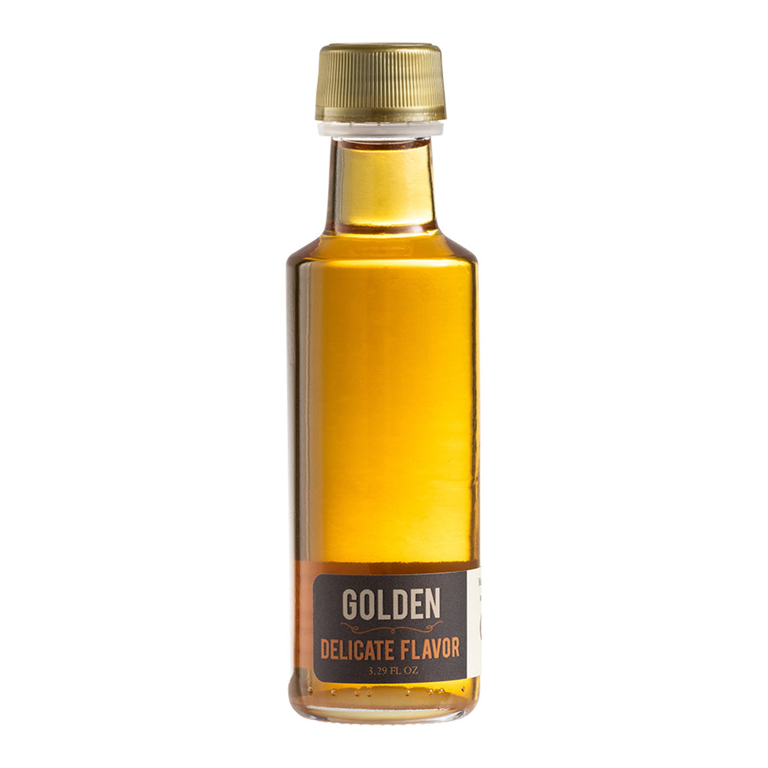 Golden delicate Vermont maple syrup wedding favor bottle.