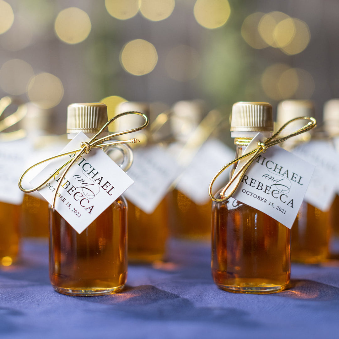 Group of 1.7 oz gallone Vermont maple syrup wedding favors arranged together for events and celebrations.
