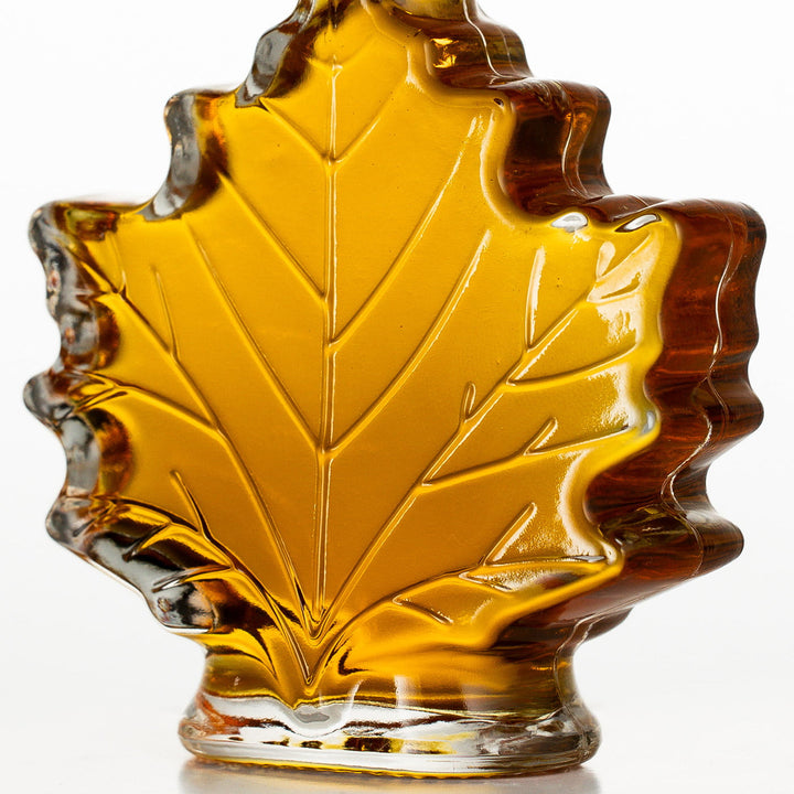 1.7 oz Vermont maple syrup leaf bottle wedding favor close up glass leaf veins no engraving.
