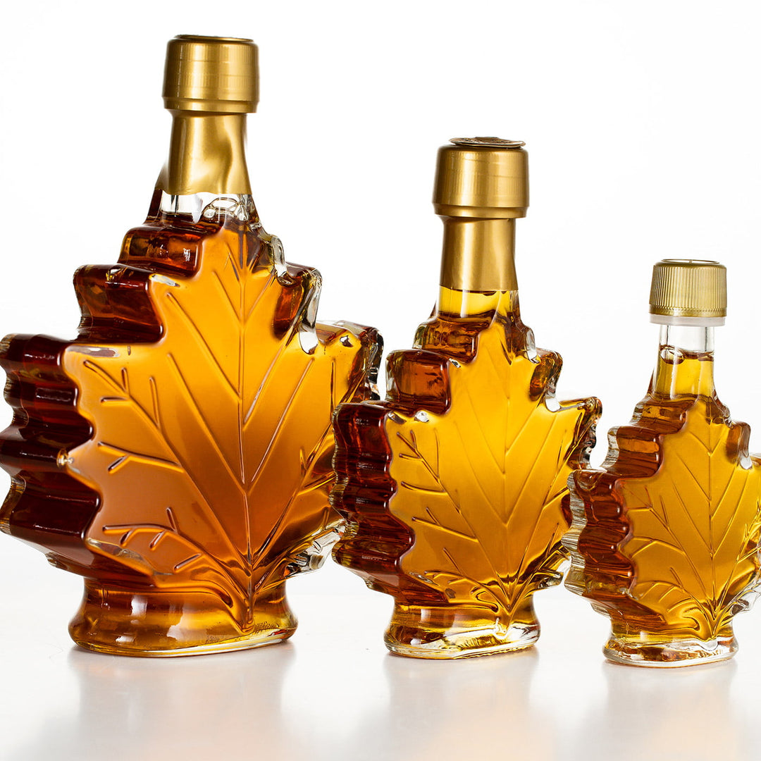 Vermont maple syrup wedding favors showing 1.7 oz, 3.29 oz, and 8.45 oz maple leaf bottles with no engraving.
