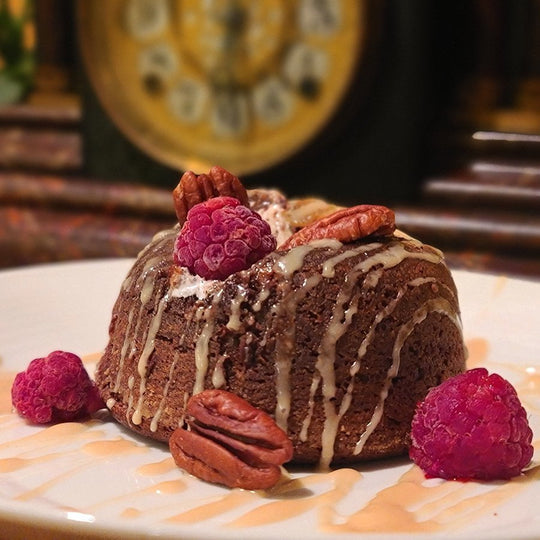 Maple chocolate lava cake garnished with summer berries from farm.